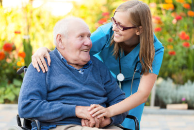 nurse assisting senior woman