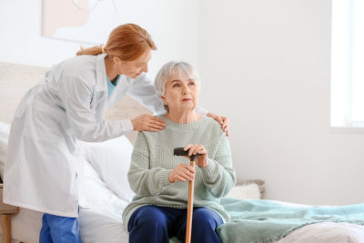 a caregiver and a nurse talking